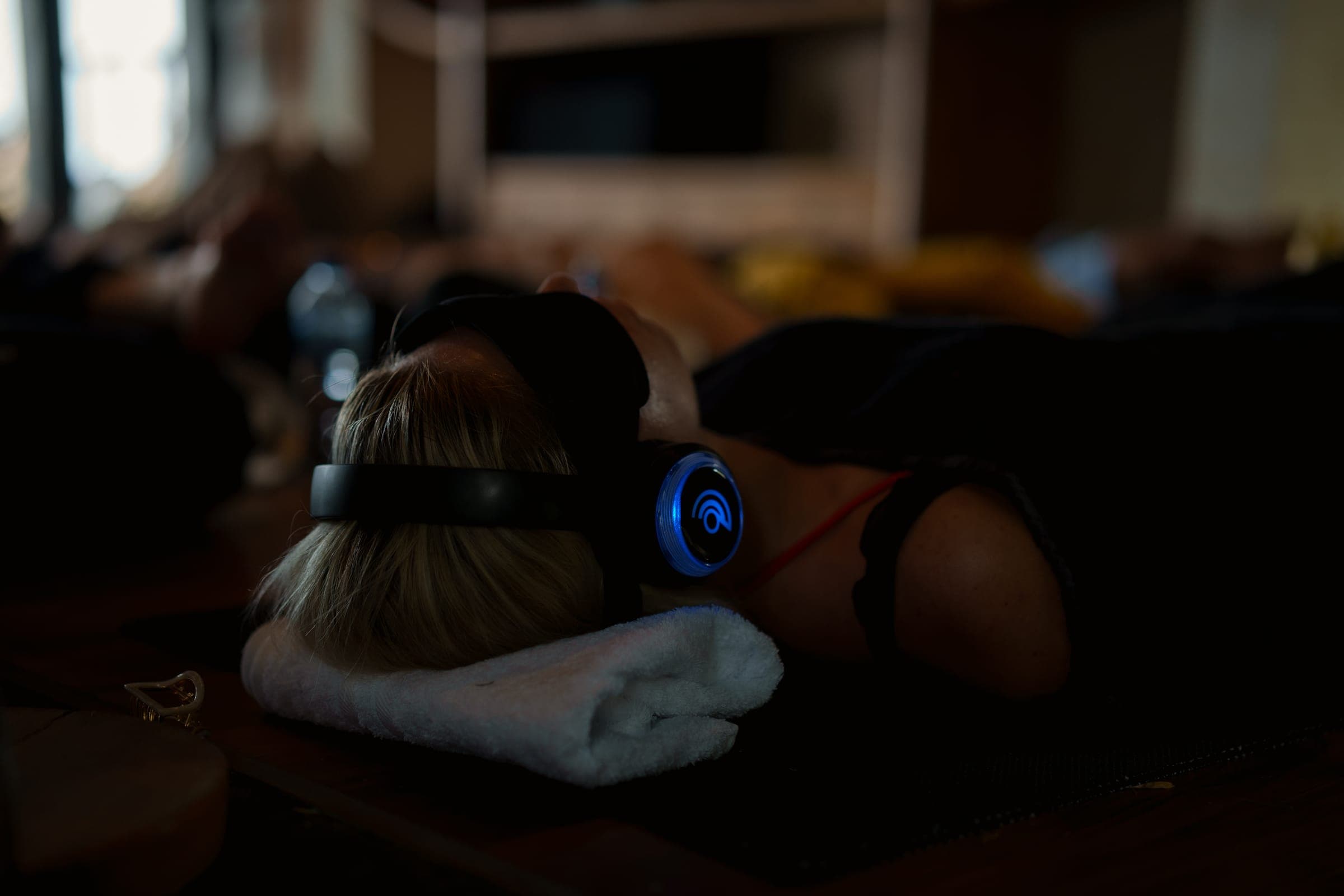 People resting in headsets during a group breathwork session