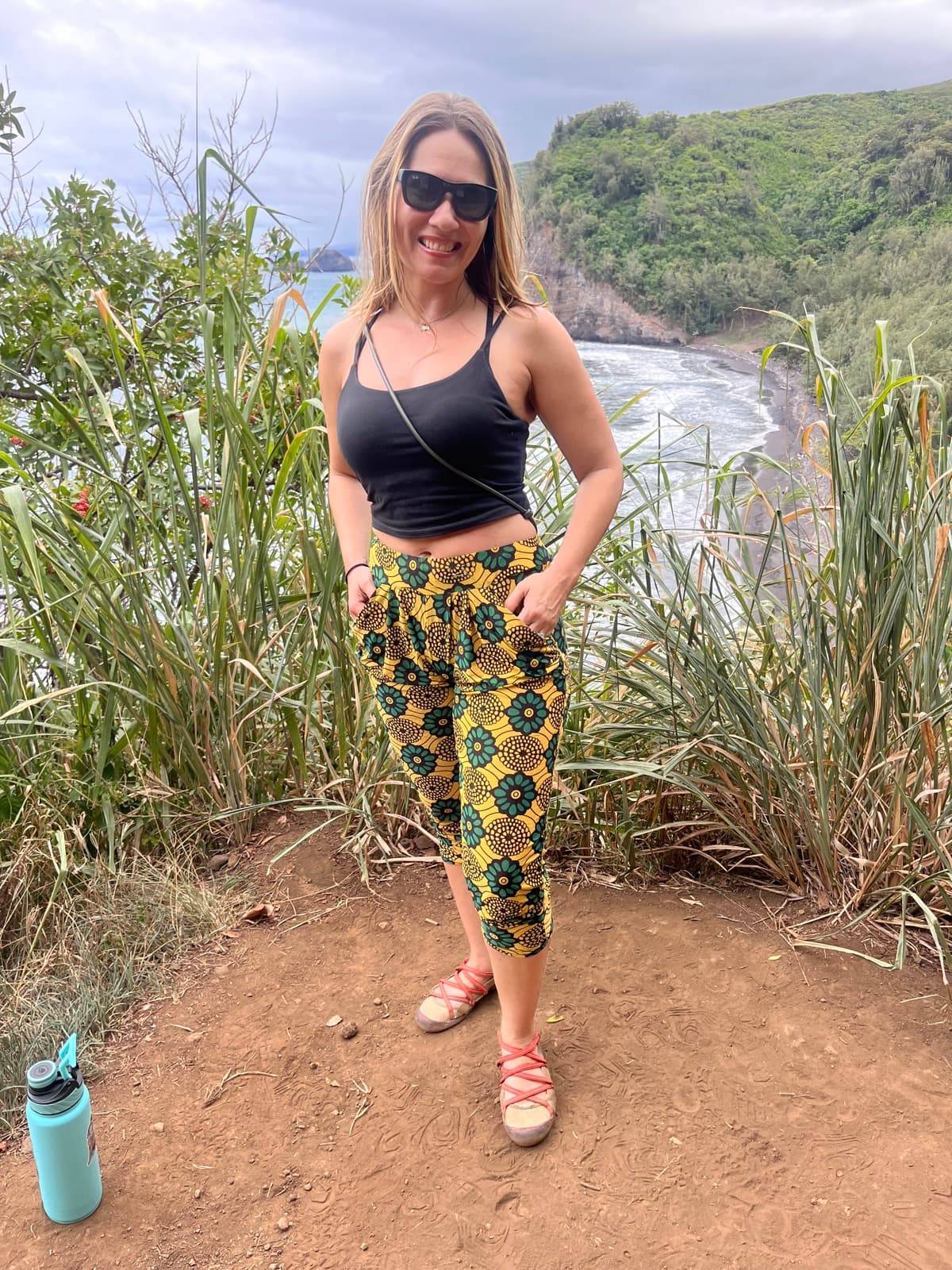 Rachel Patten on a hiking trail at a waterfall
